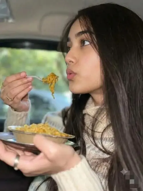 A Young Woman Enjoys a Quick Meal of Noodles in Her Car — AI Photo Editing Prompt on Faymas