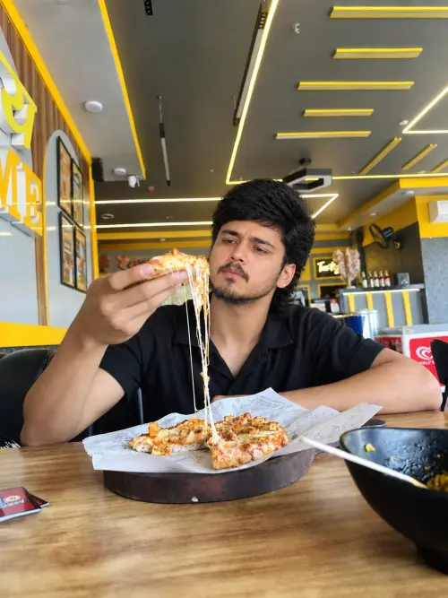 Cheesy Pizza Moment in a Modern Café — AI Photo Editing Prompt on Faymas